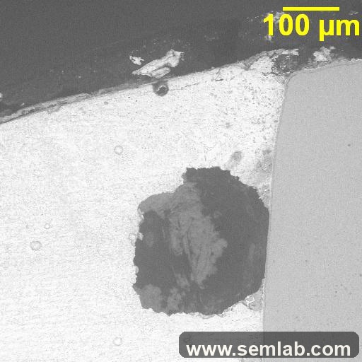 Large solder void containing entrapped material